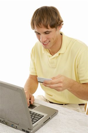 simsearch:400-04505681,k - Handsome college age man shopping on-line.  Vertical view on white background. Stock Photo - Budget Royalty-Free & Subscription, Code: 400-03997988