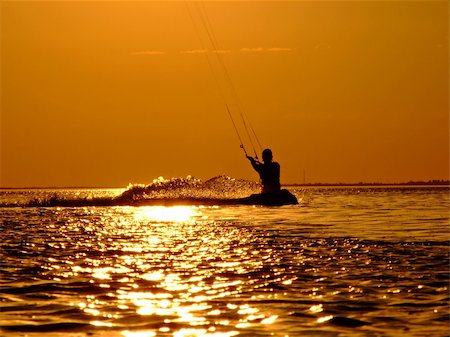 simsearch:400-03992760,k - Silhouette of a kite-surf on waves of a gulf on a sunset 2 Stock Photo - Budget Royalty-Free & Subscription, Code: 400-03998077