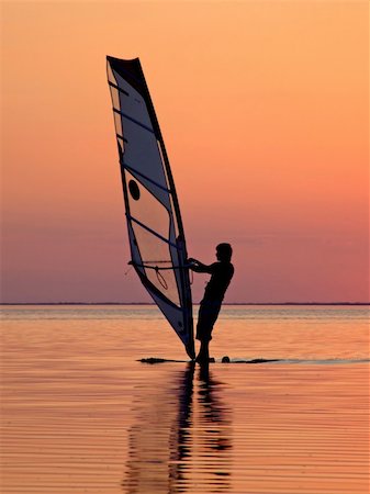 simsearch:400-03992760,k - Silhouette of a wind-surfer on waves of a gulf on a sunset 3 Stock Photo - Budget Royalty-Free & Subscription, Code: 400-03998078