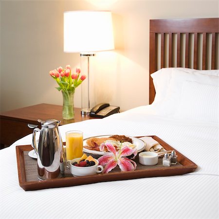 Breakfast tray laying on white bed in upscale hotel. Stock Photo - Budget Royalty-Free & Subscription, Code: 400-03998265