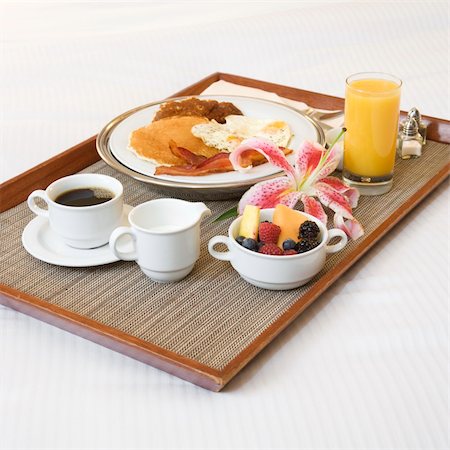 Close-up of breakfast tray laying on white bed. Stock Photo - Budget Royalty-Free & Subscription, Code: 400-03998266