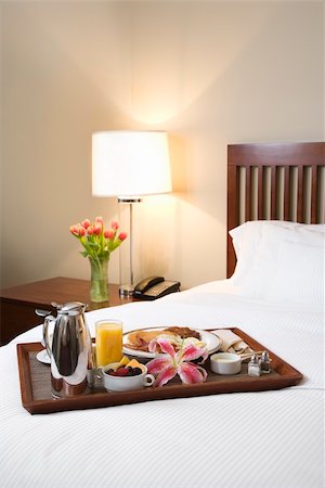 Breakfast tray laying on white bed in upscale hotel. Stock Photo - Budget Royalty-Free & Subscription, Code: 400-03998263