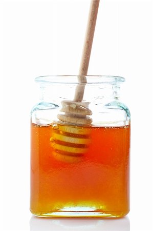 simsearch:400-05135233,k - A wooden drizzler inside of honey jar, reflected on white background Foto de stock - Super Valor sin royalties y Suscripción, Código: 400-03991940