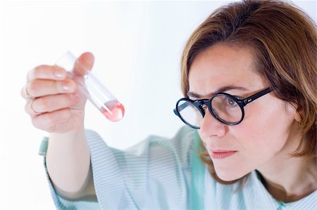simsearch:400-09011632,k - Scientist woman analyzing chemical material in test tube Stock Photo - Budget Royalty-Free & Subscription, Code: 400-03992029