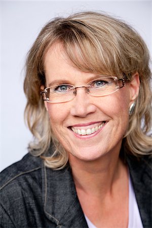 forty wrinkle - Portrait of Woman Wearing Eyeglasses Stock Photo - Premium Royalty-Free, Code: 600-04163435