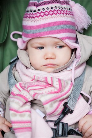 Close-up of Baby Girl Sitting in Car Seat wearing Winter Clothing Stock Photo - Premium Royalty-Free, Code: 600-04425023
