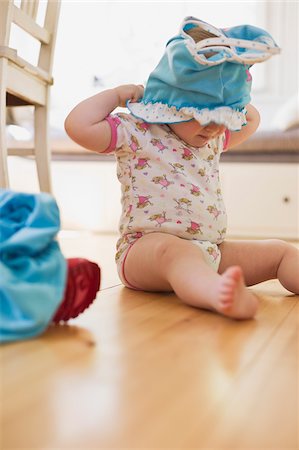 funny baby - Girl Getting Dressed Stock Photo - Premium Royalty-Free, Code: 600-04525179