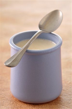 sweet   no people - Close-up of Spoon Balanced on Mug of Yogurt Stock Photo - Premium Royalty-Free, Code: 600-04625244