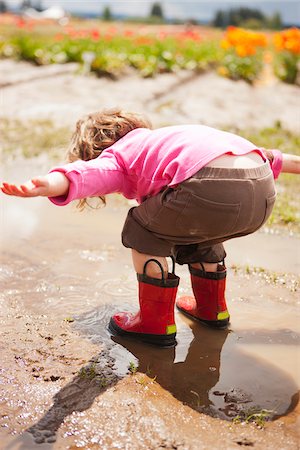 rubber boots in little girl - Girl, Woodburn, Marion County, Oregon, USA Stock Photo - Premium Royalty-Free, Code: 600-04931721