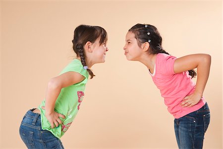 preteen girl pigtails - Girls Making Faces Stock Photo - Premium Royalty-Free, Code: 600-05653071