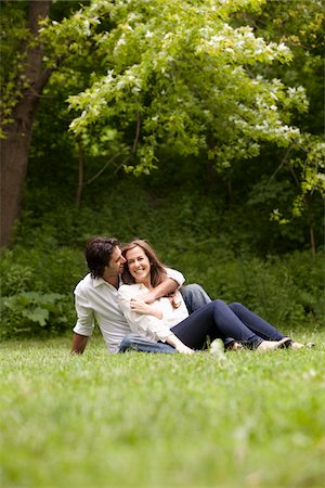 simsearch:700-00529622,k - Young Couple Sitting on Grass in Park Stock Photo - Premium Royalty-Free, Code: 600-05786146