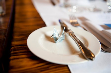 simsearch:600-05786661,k - Origami Crane on Place Setting Stock Photo - Premium Royalty-Free, Code: 600-05786582