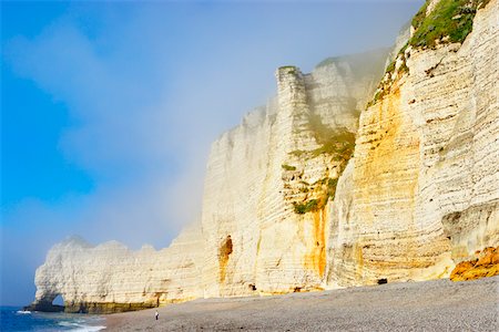 rocks water mist sky - White Chalk Cliffs and Pebble Beach, Etretat, Normandy, France Stock Photo - Premium Royalty-Free, Code: 600-05803665