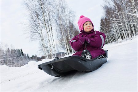 sleds - Little Girl on Sled in Winter Stock Photo - Premium Royalty-Free, Code: 600-05973088