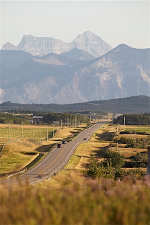 Rural Road and Rocky Mountains, Pincher Creek, Alberta, Canada Stock Photo - Premium Royalty-Free, Code: 600-05973203