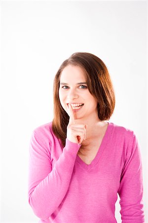 shhh - Portrait of Young Woman Stock Photo - Premium Royalty-Free, Code: 600-06009290