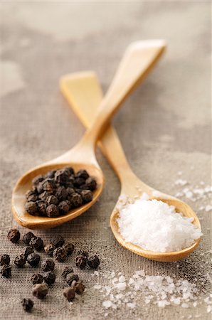 spices - Rock Salt and Peppercorns in Wooden Spoons Stock Photo - Premium Royalty-Free, Code: 600-06025236