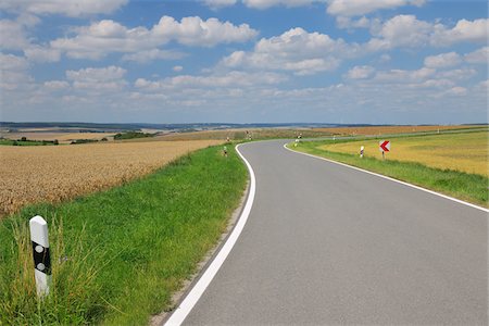 simsearch:600-08232277,k - Country Road in Summer, Butthard, Wurzburg District, Franconia, Bavaria, Germany Stock Photo - Premium Royalty-Free, Code: 600-06119750