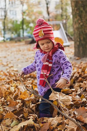 Girl in Fall Leaves, Germany Stock Photo - Premium Royalty-Free, Code: 600-06144986