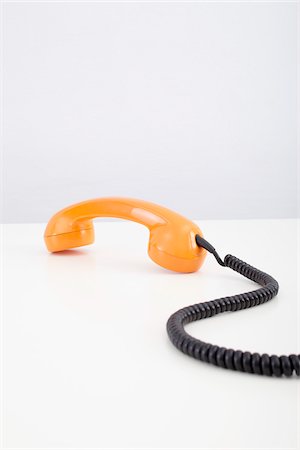 Orange Telephone Receiver Stock Photo - Premium Royalty-Free, Code: 600-06302224