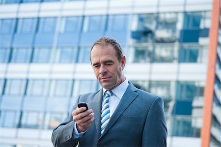 Businessman using Cell Phone, Niederrad, Frankfurt, Germany Stock Photo - Premium Royalty-Free, Code: 600-06355237