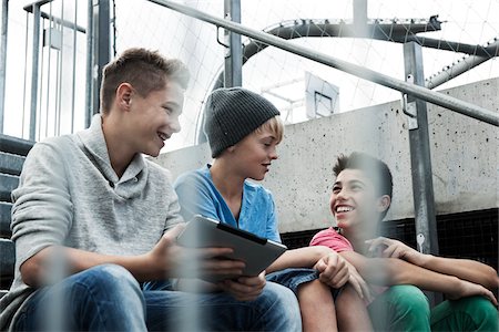 fifteen year old preteen - Boys with Tablet Sitting on Bleachers, Mannheim, Baden-Wurttemberg, Germany Stock Photo - Premium Royalty-Free, Code: 600-06382856