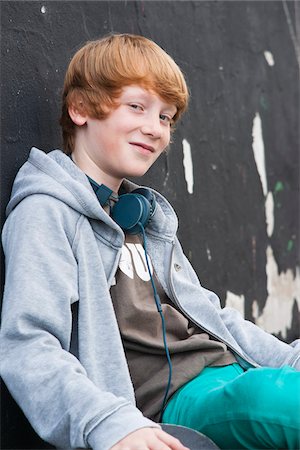 funky - Portrait of Boy wearing Headphones Outdoors, Mannheim, Baden-Wurttemberg, Germany Stock Photo - Premium Royalty-Free, Code: 600-06397435