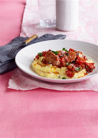 Sausage with Tomatoes on Polenta Stock Photo - Premium Royalty-Free, Code: 600-06397669