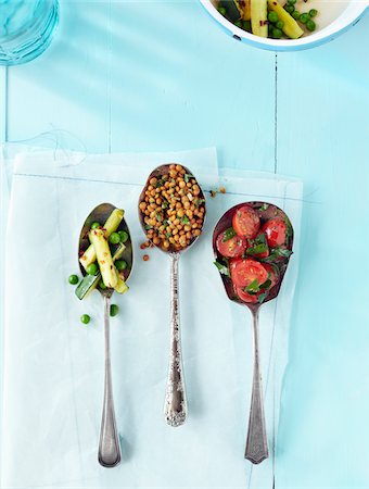 Overhead View of Variety of Salads in Serving Spoons Stock Photo - Premium Royalty-Free, Code: 600-06397677