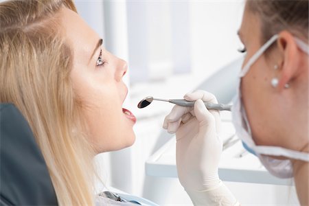 dentistry - Young Woman getting Check-up at Dentist's Office, Germany Stock Photo - Premium Royalty-Free, Code: 600-06438882