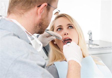 dental care woman - Young Woman and Dentist at Dentist's Office for Appointment, Germany Stock Photo - Premium Royalty-Free, Code: 600-06438894