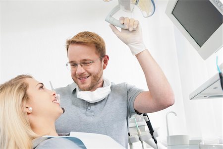dental bib - Young Woman and Dentist at Dentist's Office for Appointment, Germany Stock Photo - Premium Royalty-Free, Code: 600-06438897