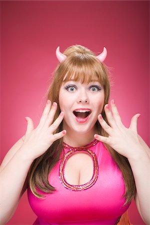 funny pose - Portrait of Woman Wearing Devil Horns Making Faces Foto de stock - Sin royalties Premium, Código: 600-06431374