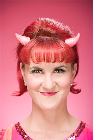 simsearch:600-03891313,k - Portrait of Woman Wearing Devil Horns Stock Photo - Premium Royalty-Free, Code: 600-06431407