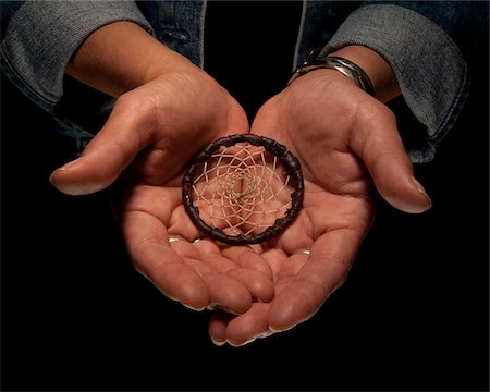 palm of hand - Close-up of Woman's Hands holding Dreamcatcher, Studio Shot Stock Photo - Premium Royalty-Free, Code: 600-06452120