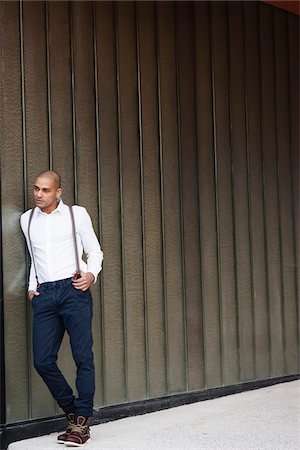 Portrait of Man Leaning Against Wall, Mannheim, Baden-Wurttemberg, Germany Stock Photo - Premium Royalty-Free, Code: 600-06485955