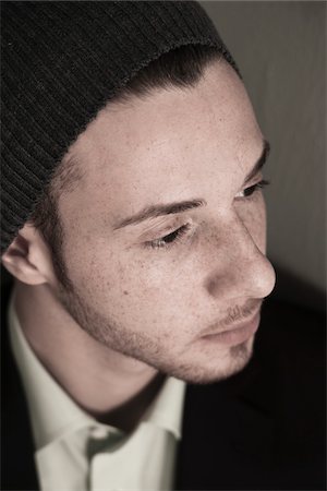 simsearch:700-07237989,k - Close-up, High Angle View of Young Man wearing Woolen Hat, Studio Shot Stock Photo - Premium Royalty-Free, Code: 600-06486247