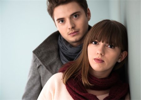 fashionable couple - Head and Shoulder Portrait of Young Couple Looking at Camera, Studio Shot on Grey Background Stock Photo - Premium Royalty-Free, Code: 600-06486257