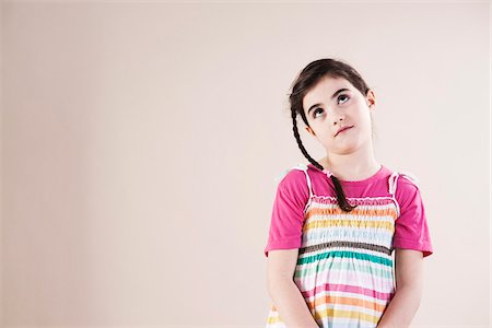 female dress white background - Portrait of Girl Looking up in Studio Stock Photo - Premium Royalty-Free, Code: 600-06486411