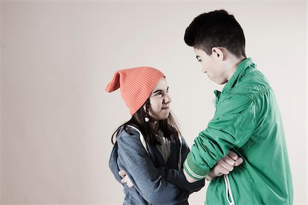 simsearch:600-06685174,k - Girl and Boy Arguing in Studio Stock Photo - Premium Royalty-Free, Code: 600-06486435