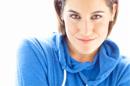 Head and Shoulders Portrait of Woman wearing Hoodie in Studio Stock Photo - Premium Royalty-Free, Code: 600-06531606