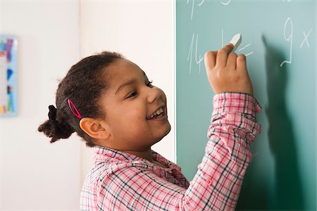 students in classroom - Girl Answering Question at Blackboard in Classroom, Baden-Wurttemberg, Germany Stock Photo - Premium Royalty-Free, Code: 600-06548568