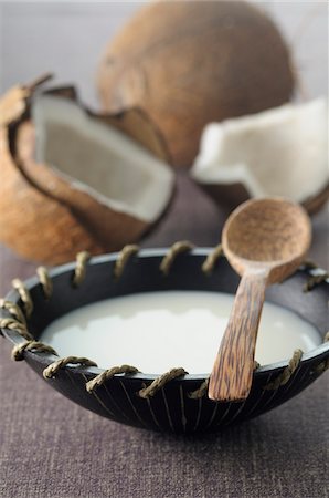 simsearch:600-06671821,k - Coconut Milk in Bowl with Wooden Spoon, Coconuts in Background Photographie de stock - Premium Libres de Droits, Code: 600-06553465