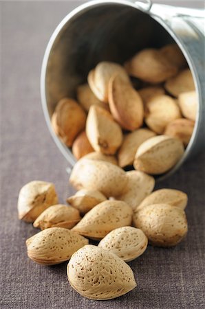 pail - Close-up of Bucket of Almonds Spilling Stock Photo - Premium Royalty-Free, Code: 600-06553492