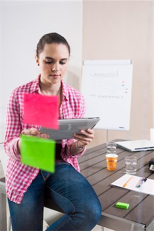 drawing computer - Young Woman Working in an Office, Looking Through Glass Board, Germany Stock Photo - Premium Royalty-Free, Code: 600-06620939