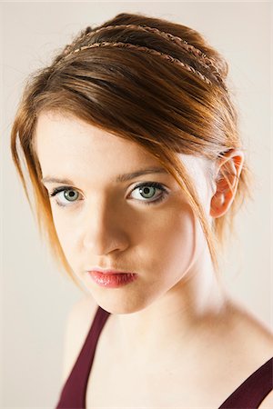 simsearch:700-06826406,k - Close-up Portrait of Teenage Girl in Upsweep Hairstyle and wearing Make-up, Studio Shot on White Background Stock Photo - Premium Royalty-Free, Code: 600-06621026