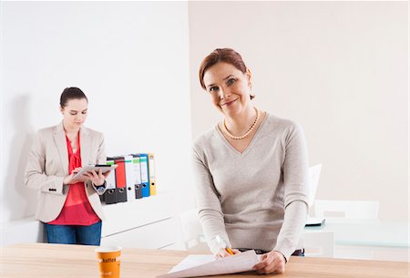 simsearch:600-06355235,k - Women Working in Office Stock Photo - Premium Royalty-Free, Code: 600-06645516