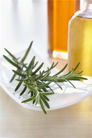 Rosemary with bottle of aromatic oil for aromatherapy Stock Photo - Premium Royalty-Free, Code: 600-06675003