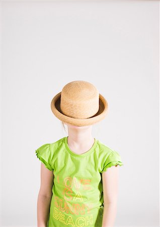 simsearch:600-06685174,k - Portrait of Girl with Hat Covering her Face in Studio Stock Photo - Premium Royalty-Free, Code: 600-06685176