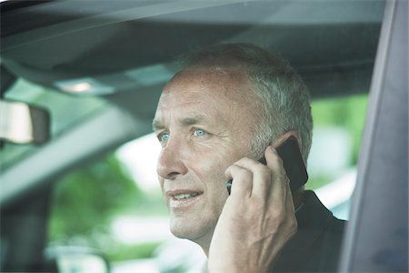 Businessman Talking on Cell Phone in Car, Mannheim, Baden-Wurttemberg, Germany Stock Photo - Premium Royalty-Free, Code: 600-06773355